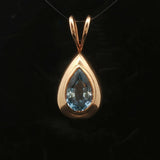 14k Yellow Gold and Pear Cut Blue Topaz 5.2g Pendant 1.2"