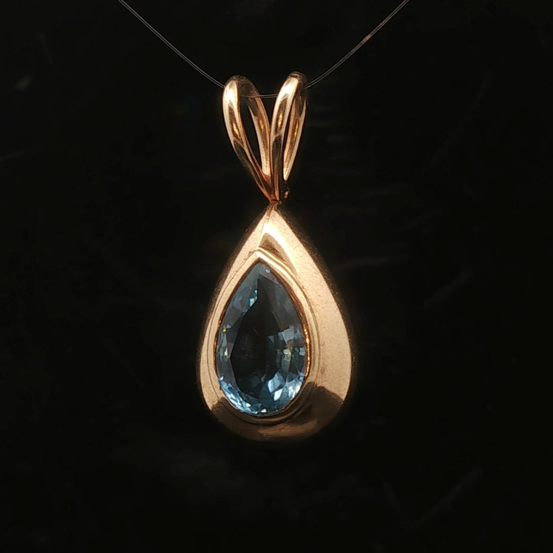 14k Yellow Gold and Pear Cut Blue Topaz 5.2g Pendant 1.2"