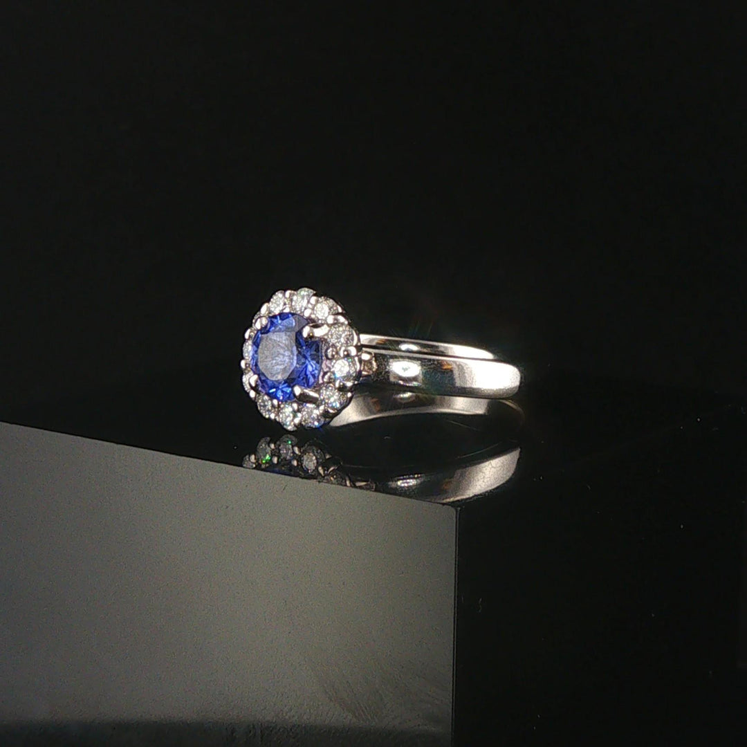 Platinum 0.68cttw Tanzanite and 0.25cttw Diamond Halo Ring Size 6.5