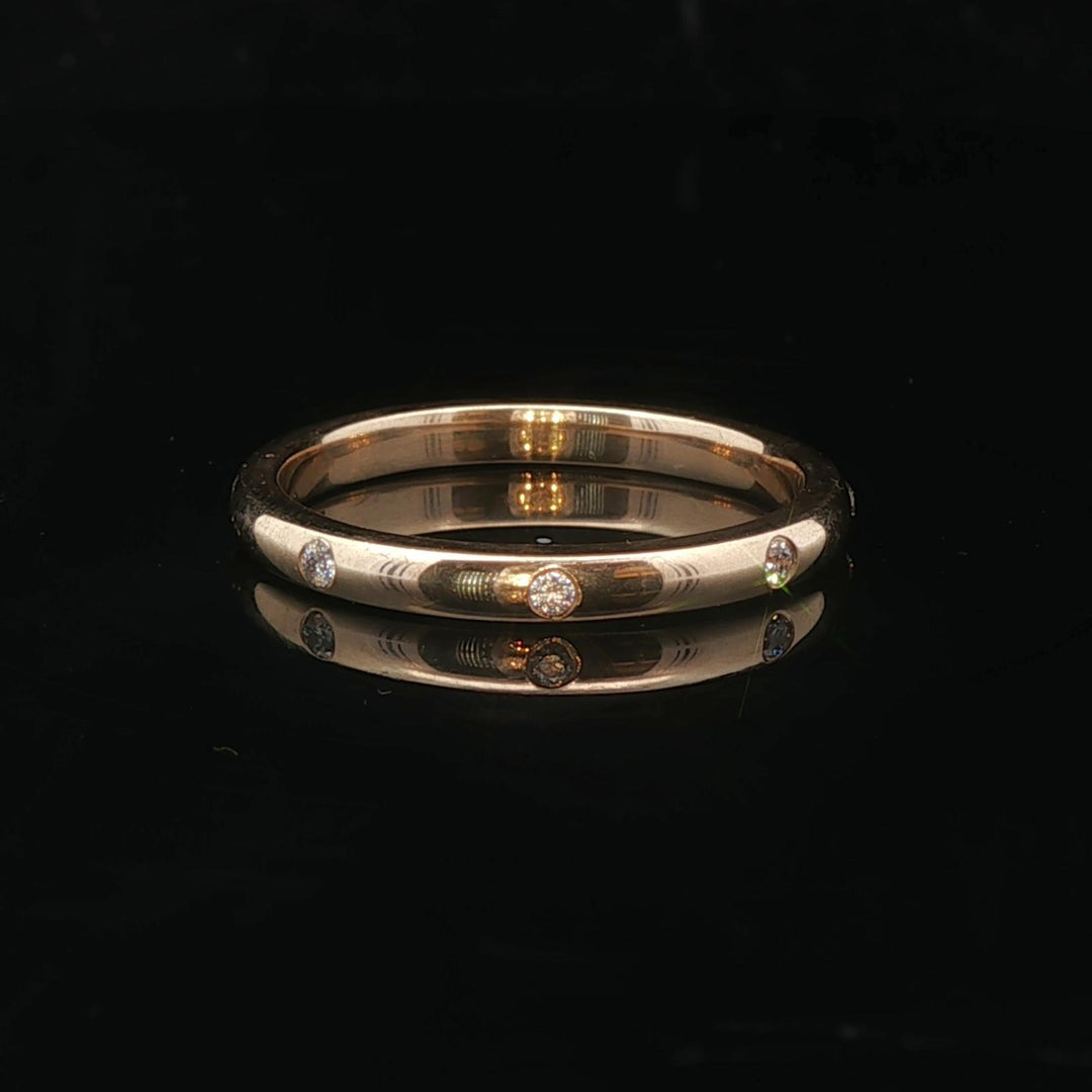 14k Yellow Gold and 0.08cttw Flush Set Diamond 2.5mm Eternity Band Size 7.75