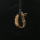 14k Yellow Gold and 0.25cttw Round and Baguette Diamond Huggie Earrings