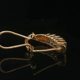 14k Yellow Gold and 0.25cttw Round and Baguette Diamond Huggie Earrings