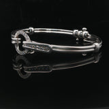 18k White Gold and Diamond 20.5g Circle Motif Bangle Bracelet 6.25"