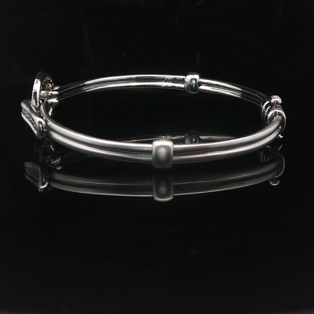 18k White Gold and Diamond 20.5g Circle Motif Bangle Bracelet 6.25"