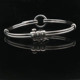 18k White Gold and Diamond 20.5g Circle Motif Bangle Bracelet 6.25"