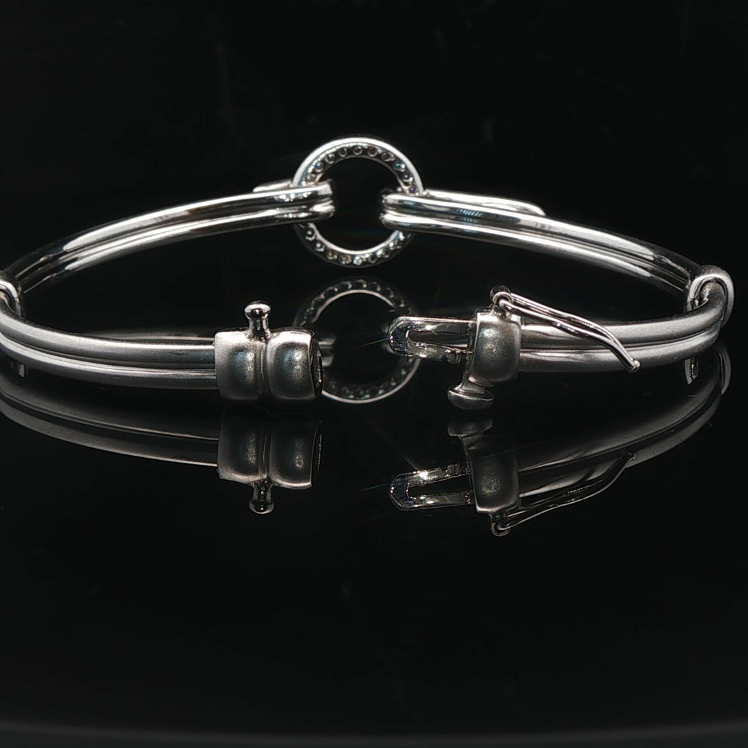 18k White Gold and Diamond 20.5g Circle Motif Bangle Bracelet 6.25"