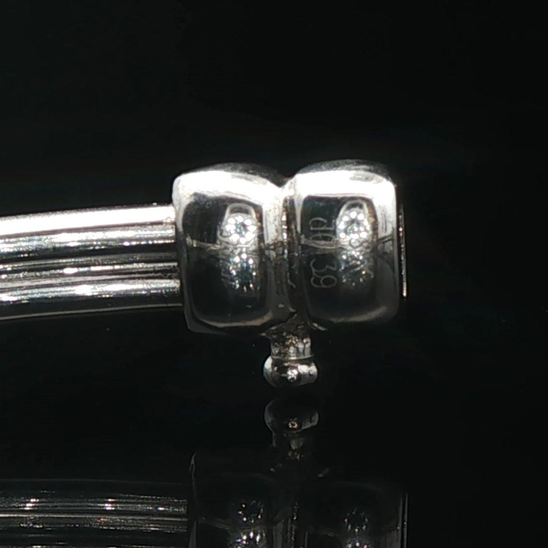 18k White Gold and Diamond 20.5g Circle Motif Bangle Bracelet 6.25"