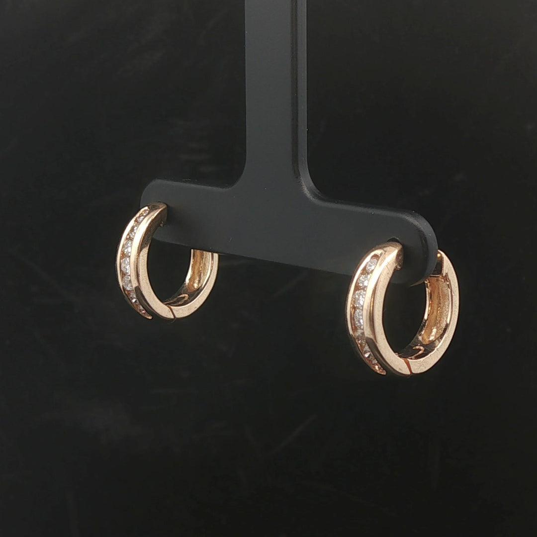 14k Yellow Gold and 0.25cttw Diamond Huggie Earrings