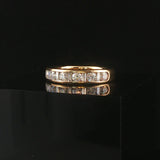 14k Yellow Gold and 0.70cttw Round and Baguette Cut Diamond Band Ring Size 6.5