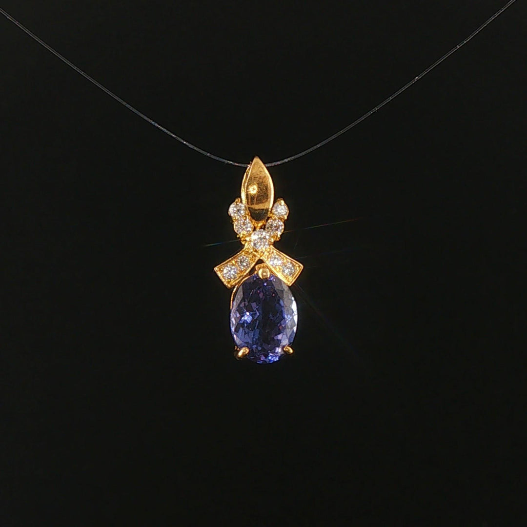18k Yellow Gold 1.22ct Tanzanite and Diamond Bow Pendant 0.75"