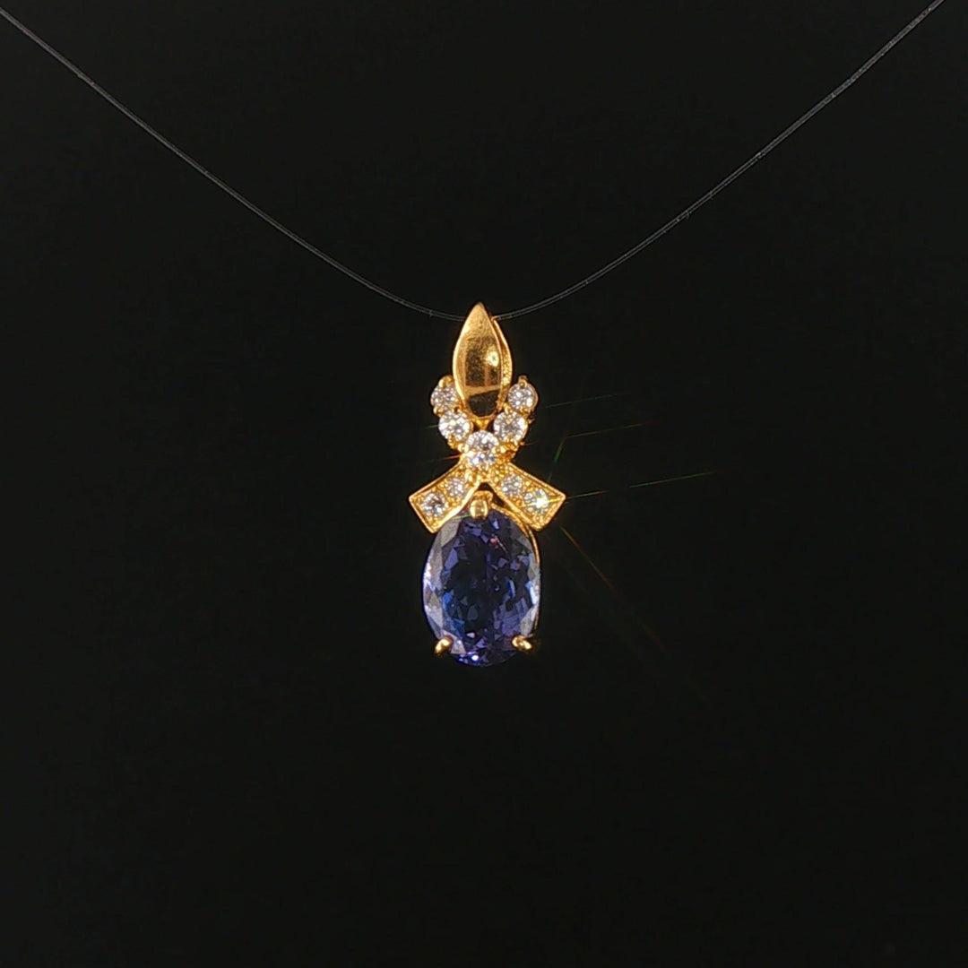 18k Yellow Gold 1.22ct Tanzanite and Diamond Bow Pendant 0.75"