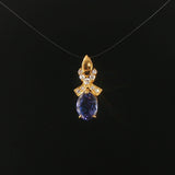 18k Yellow Gold 1.22ct Tanzanite and Diamond Bow Pendant 0.75"