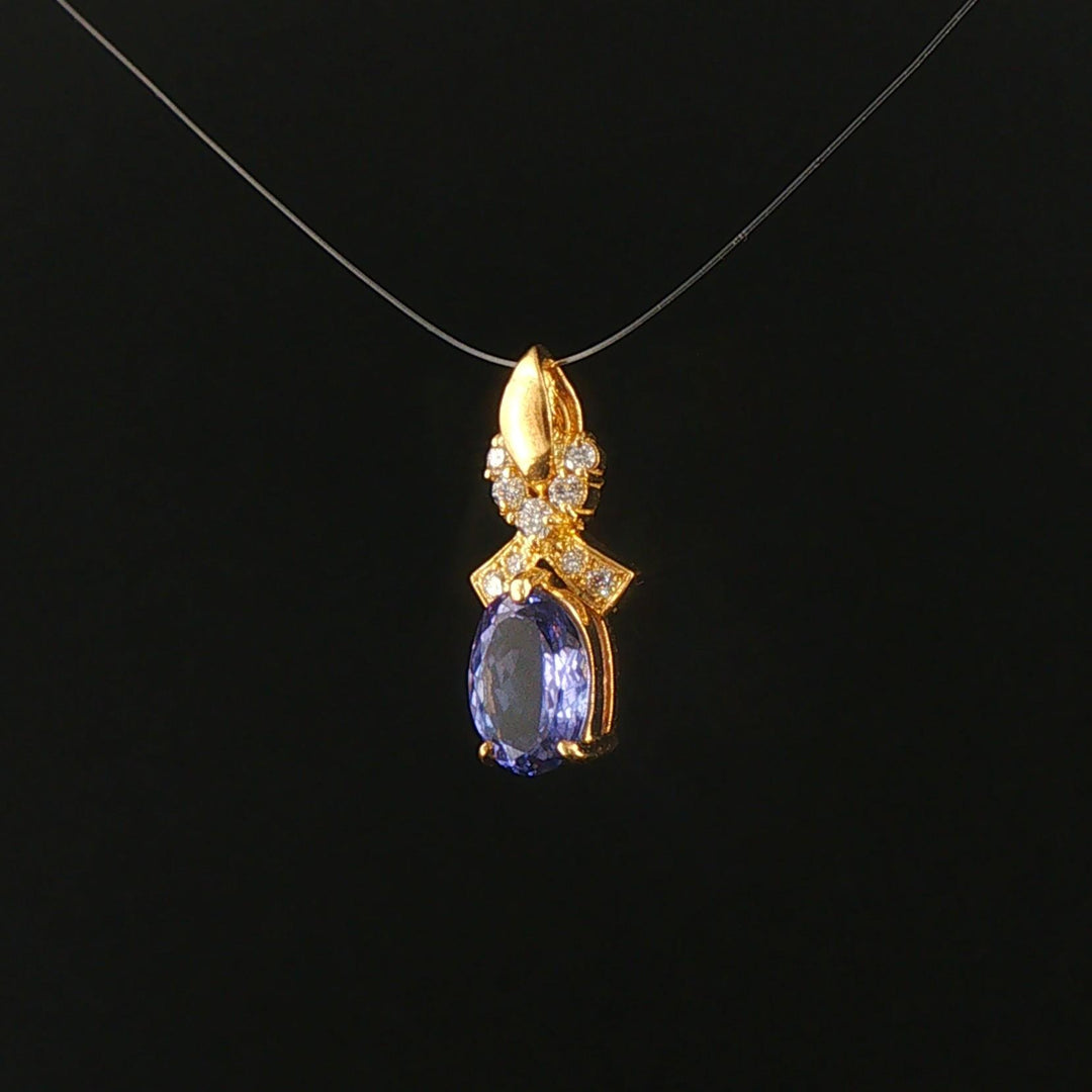 18k Yellow Gold 1.22ct Tanzanite and Diamond Bow Pendant 0.75"