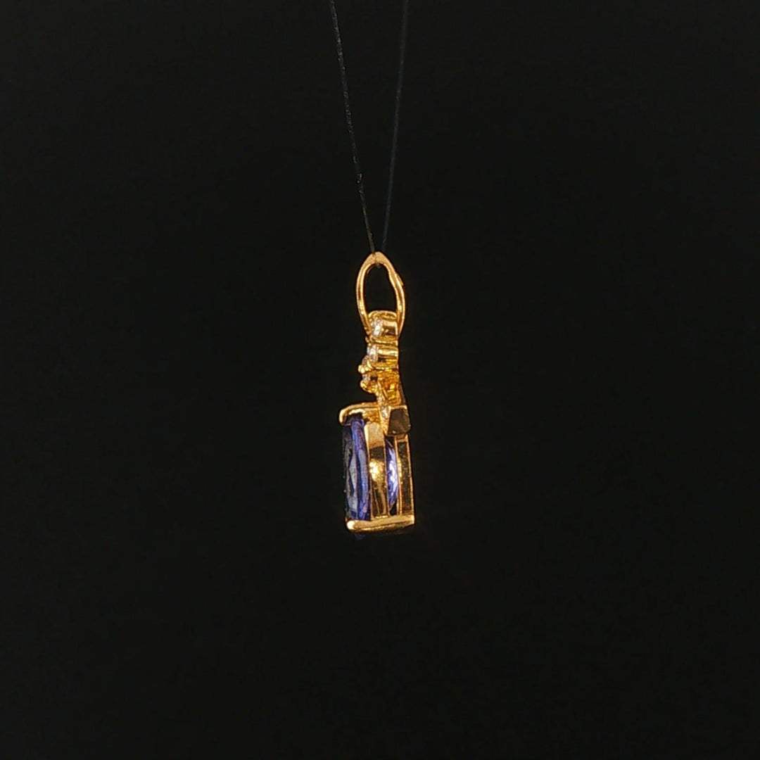 18k Yellow Gold 1.22ct Tanzanite and Diamond Bow Pendant 0.75"