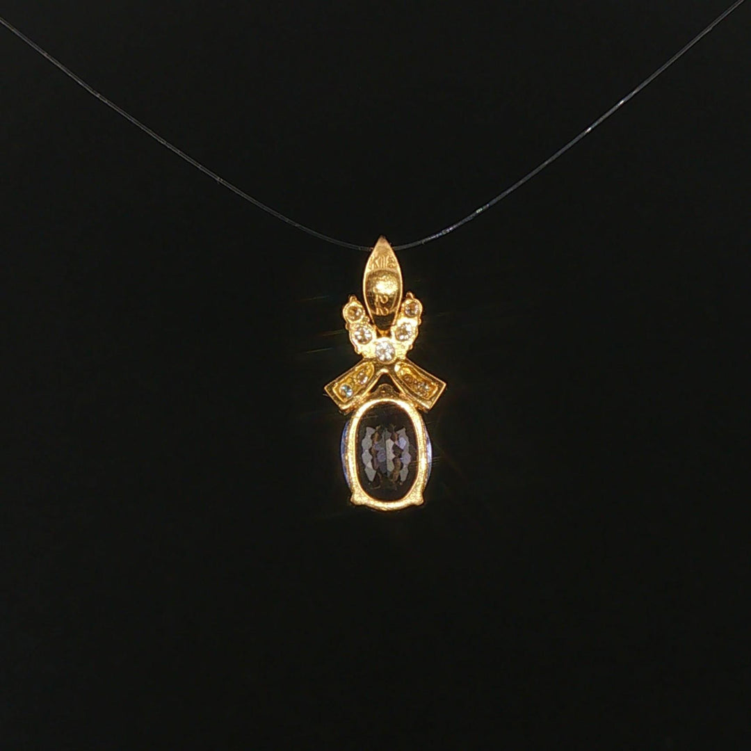 18k Yellow Gold 1.22ct Tanzanite and Diamond Bow Pendant 0.75"