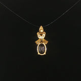 18k Yellow Gold 1.22ct Tanzanite and Diamond Bow Pendant 0.75"