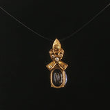 18k Yellow Gold 1.22ct Tanzanite and Diamond Bow Pendant 0.75"