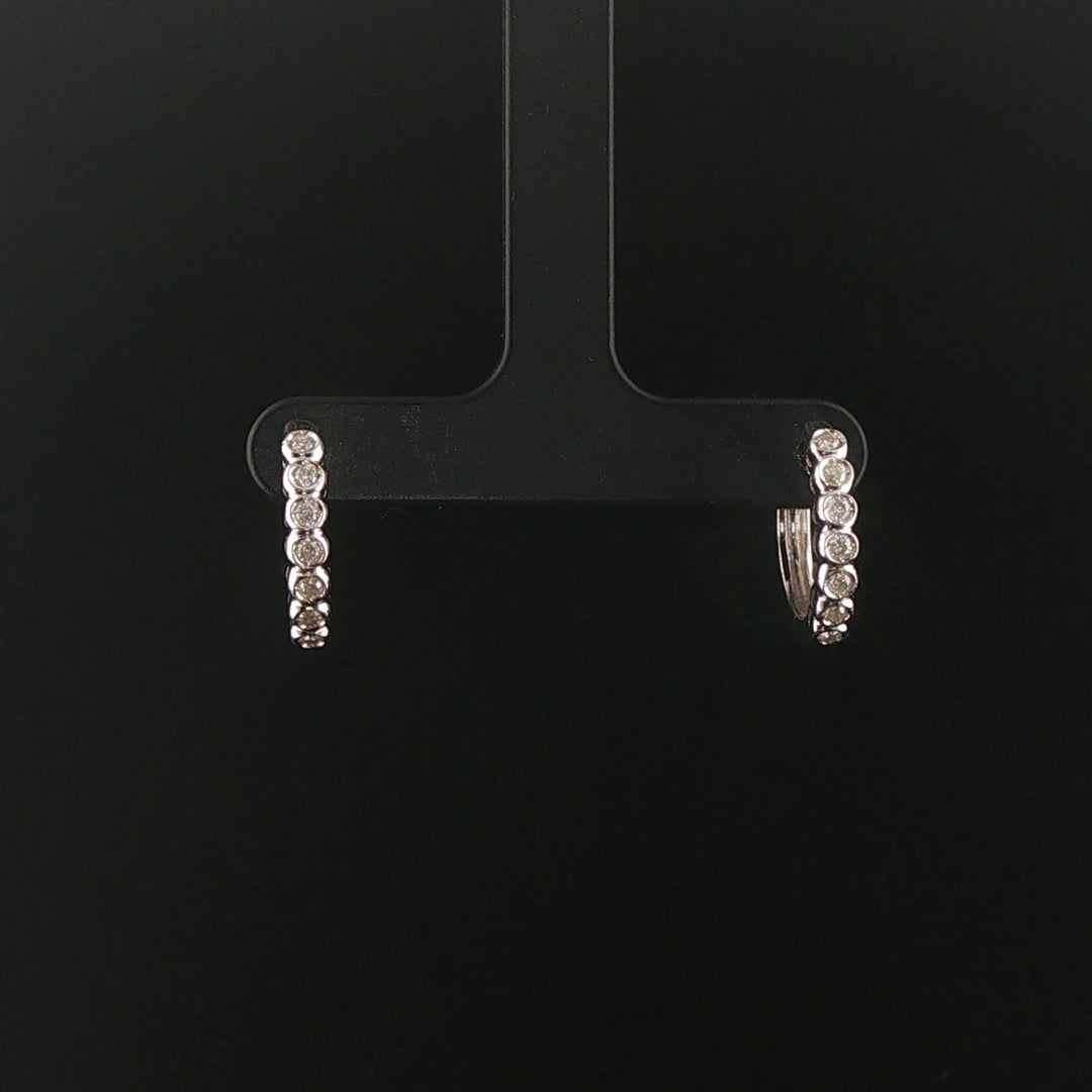 14k White Gold and 0.30cttw Bezel Set Diamonds Huggie Earrings