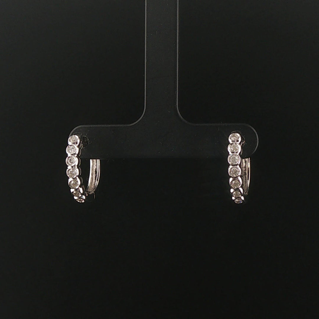 14k White Gold and 0.30cttw Bezel Set Diamonds Huggie Earrings