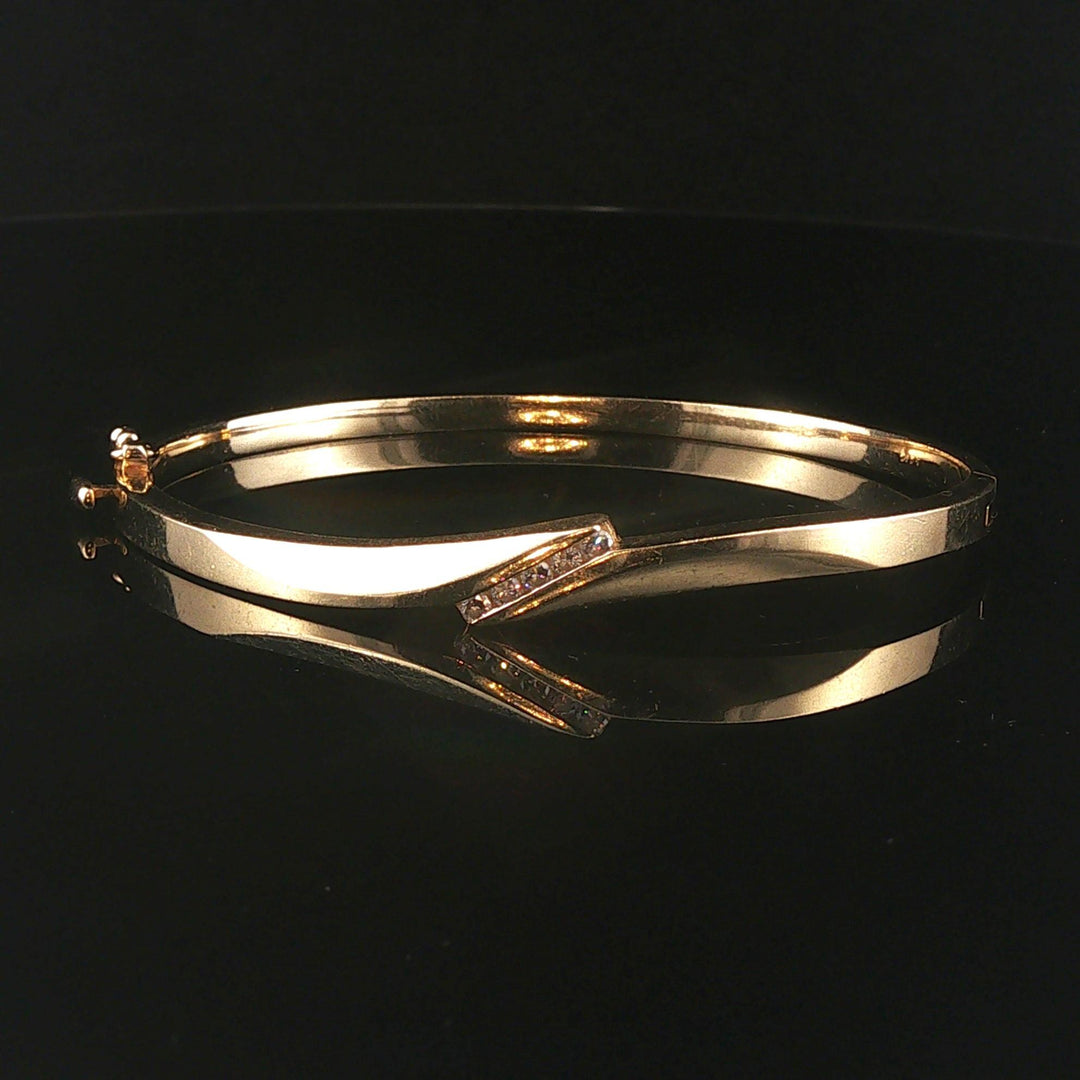 14k Yellow Gold and 0.20cttw Diamond 15.2g Bypass Bangle Bracelet 7"