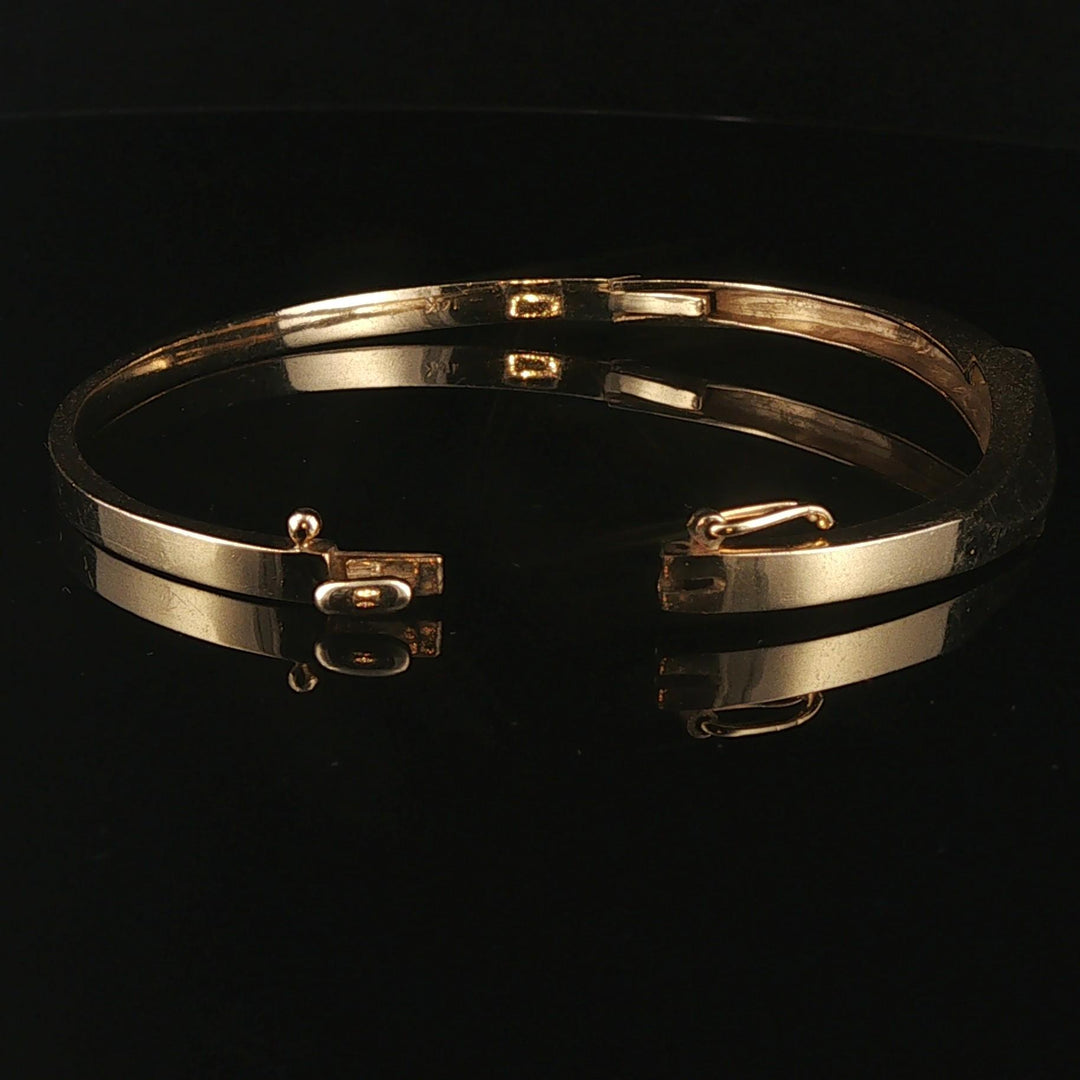 14k Yellow Gold and 0.20cttw Diamond 15.2g Bypass Bangle Bracelet 7"