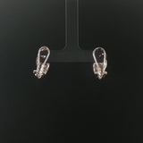14k White Gold and 0.40cttw Round and Baguette Diamond Huggie Earrings