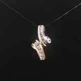 14k Yellow and White Gold 0.50cttw Round and Baguette Diamond Slide Pendant 1"