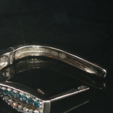 10k White Gold and 0.40cttw White and Blue Diamond Crossover Hoop Earrings