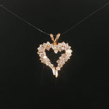 14k Yellow Gold and 0.60cttw Round and Baguette Diamond Heart Pendant