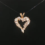 14k Yellow Gold and 0.60cttw Round and Baguette Diamond Heart Pendant