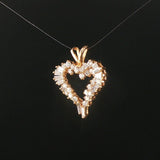 14k Yellow Gold and 0.60cttw Round and Baguette Diamond Heart Pendant