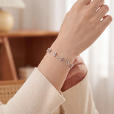 14k White Gold and 0.30cttw Bezel Set Diamond Curved Bar Link Bracelet 7"