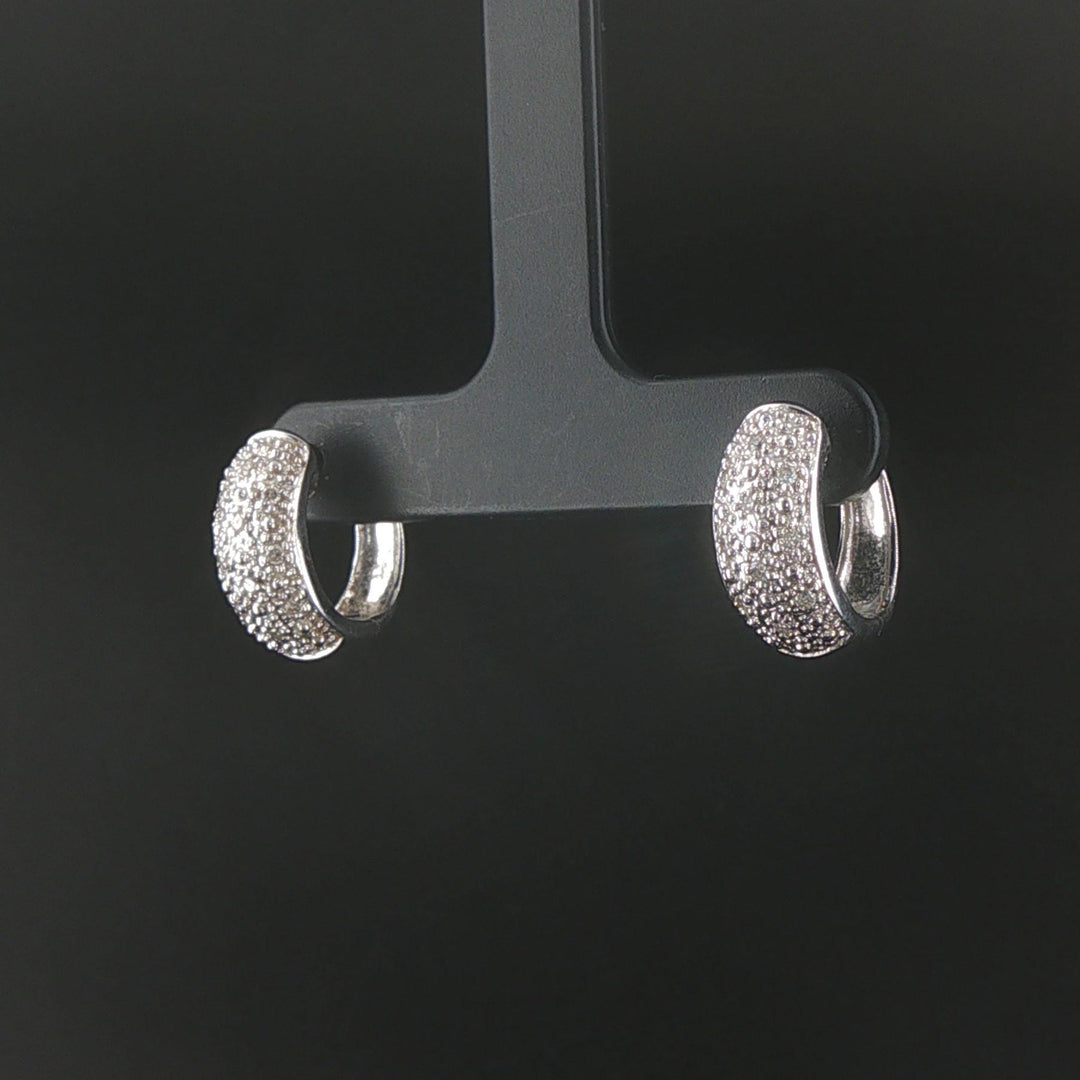 14k White Gold and 0.20cttw Diamond Huggie Earrings