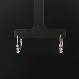 14k White Gold and 0.12cttw Graduated Diamond Small Hoop Huggie Earrings