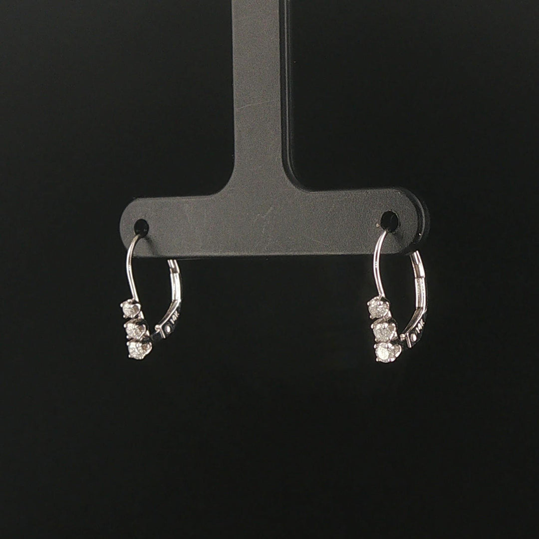 14k White Gold and 0.12cttw Graduated Diamond Small Hoop Huggie Earrings