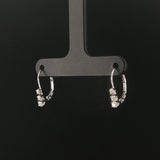 14k White Gold and 0.12cttw Graduated Diamond Small Hoop Huggie Earrings