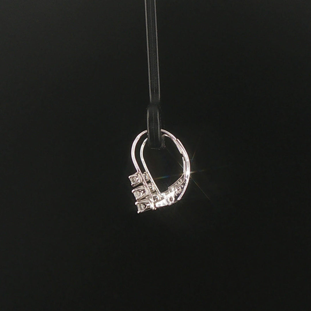 14k White Gold and 0.12cttw Graduated Diamond Small Hoop Huggie Earrings