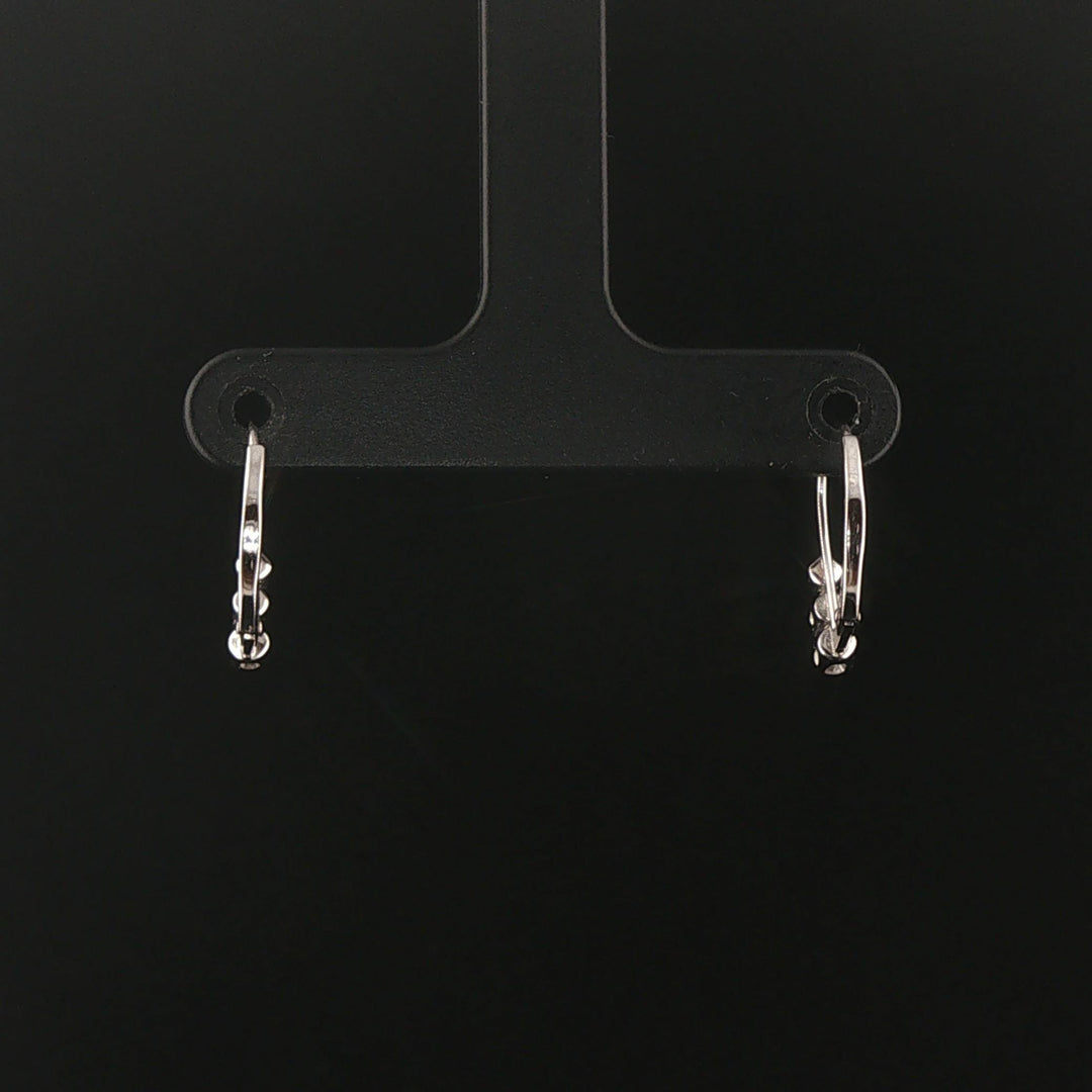 14k White Gold and 0.12cttw Graduated Diamond Small Hoop Huggie Earrings