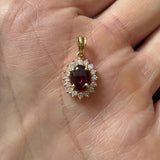 18k Yellow Gold Red Garnet and 0.50cttw Diamond Halo Pendant