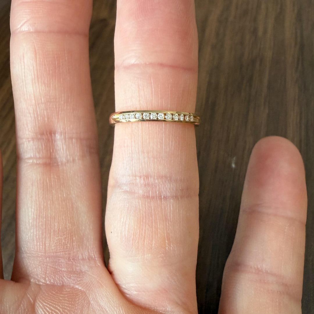 14k Yellow Gold and 0.12cttw Channel Set Diamond Thin Band Ring Size 7