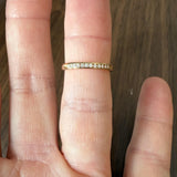 14k Yellow Gold and 0.12cttw Channel Set Diamond Thin Band Ring Size 7