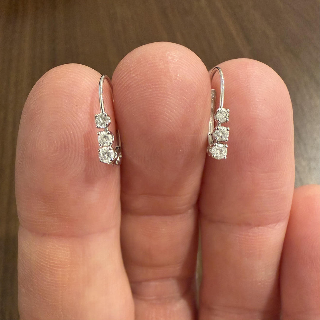 14k White Gold and 0.12cttw Graduated Diamond Small Hoop Huggie Earrings