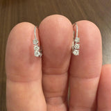14k White Gold and 0.12cttw Graduated Diamond Small Hoop Huggie Earrings