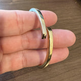 14k Yellow and White Gold 12.2g Two Tone Hinged Bypass Bangle 7"