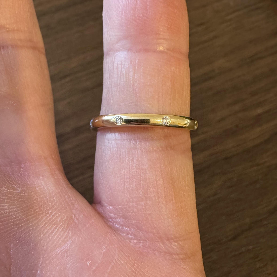 14k Yellow Gold and 0.08cttw Flush Set Diamond 2.5mm Eternity Band Size 7.75