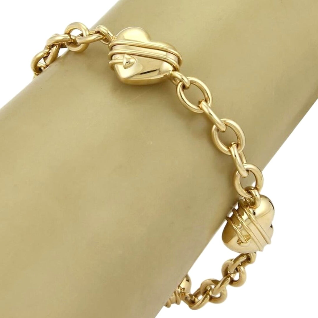 Tiffany & Co. 18k Yellow Gold Cupid Four Heart Charms Oval Link Bracelet 8.25"