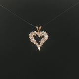 14k Yellow Gold and 0.60cttw Round and Baguette Diamond Heart Pendant