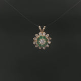 14k Yellow Gold Emerald and 0.50cttw Diamond Halo Pendant
