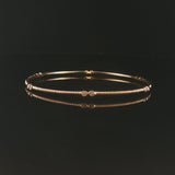 14k Yellow Gold and 0.25cttw Bezel Set Diamond Ribbed Bangle Bracelet 7.75"